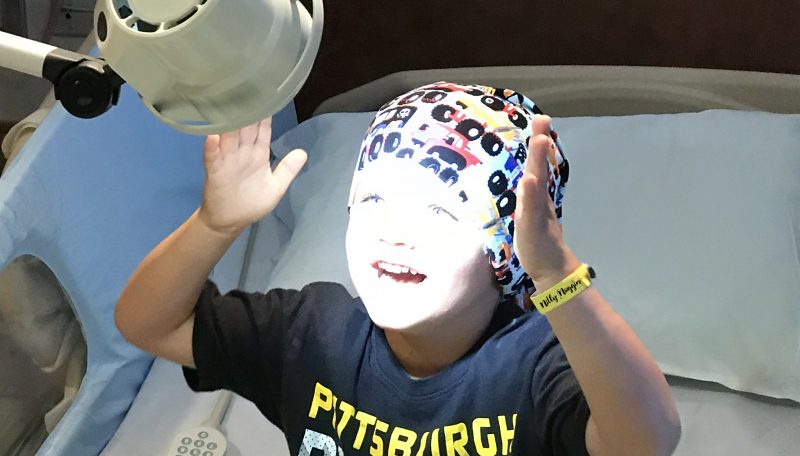 Hannahtopia NillyNoggin EEG Cap worn by child receiving EEG procedure