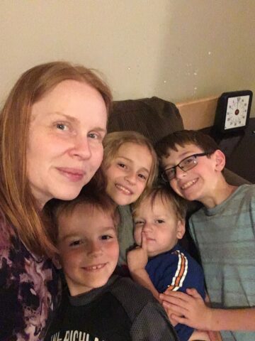 Nicholas with his mom and siblings