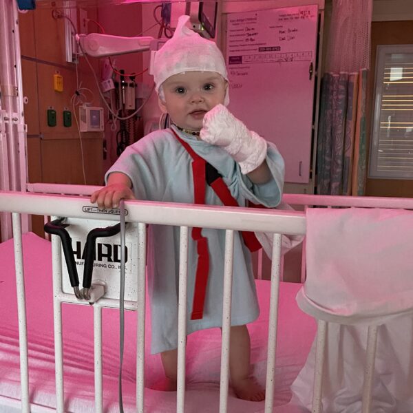 toddler standing in crib getting eeg