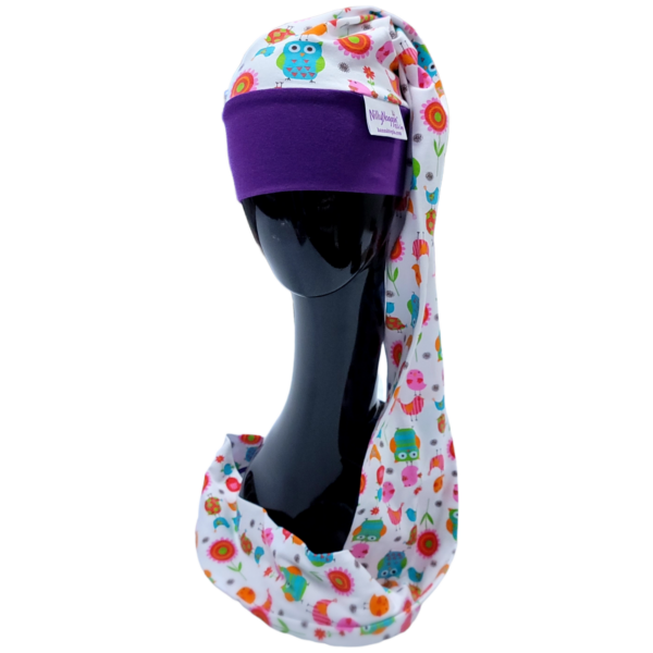 nillynoggin eeg cap with purple headband and owls on a mannequin head