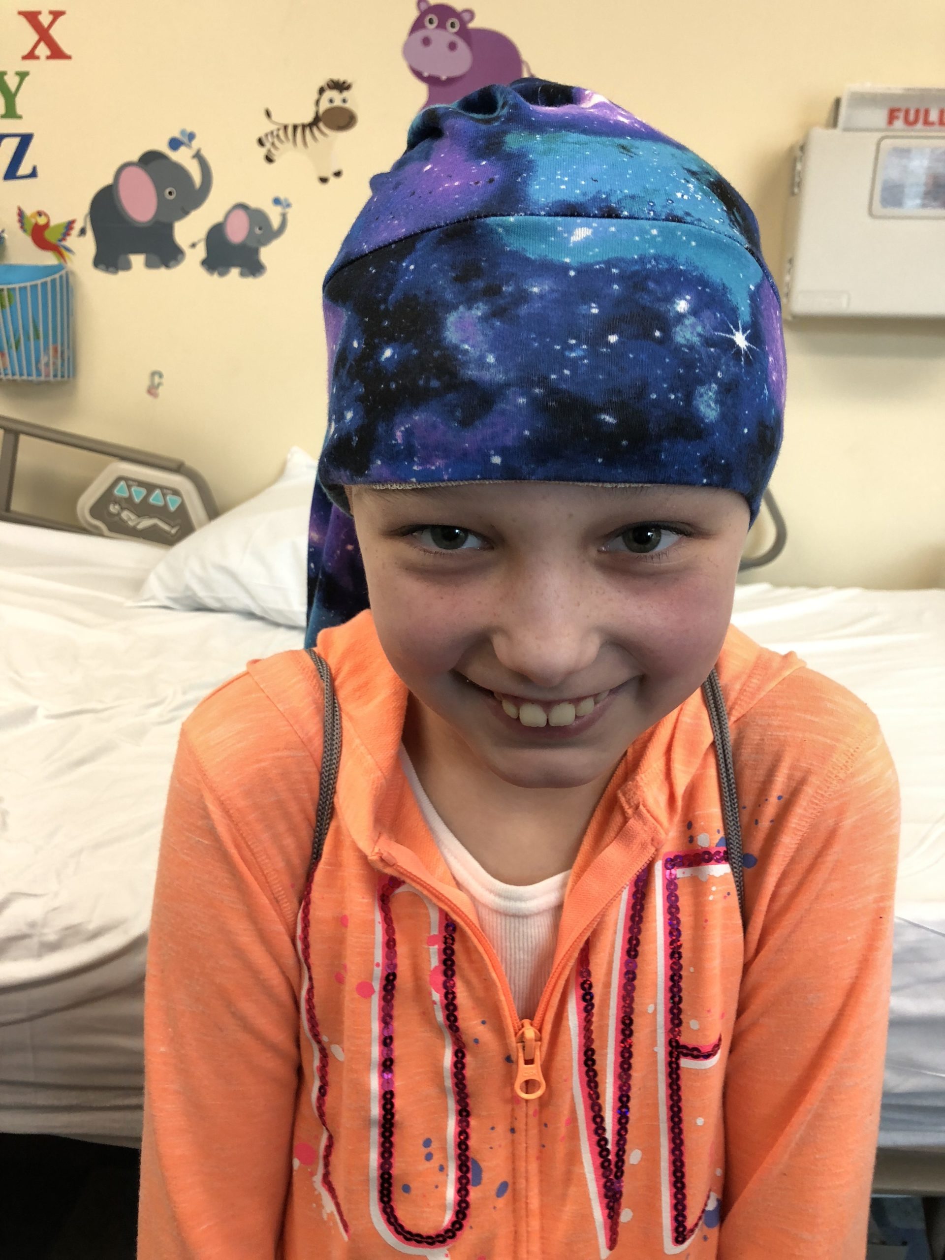 Child wearing a NillyNoggin EEG Cap during an EEG test
