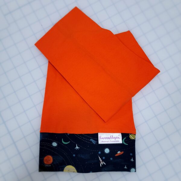 Orange NillyNoggin EEG Cap with Navy Planets and Solar System design folded