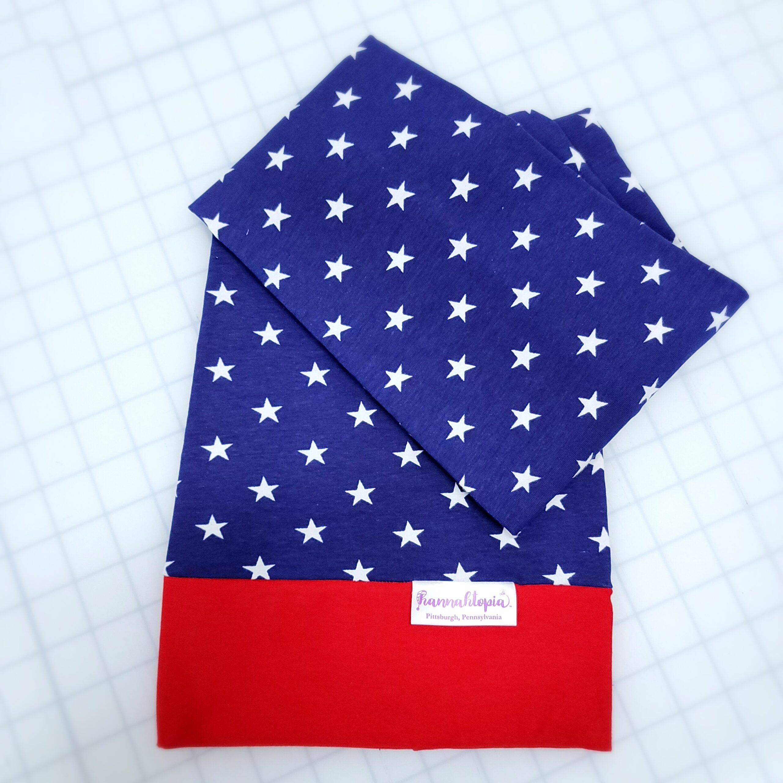 Red and Blue NillyNoggin EEG Cap with White Stars showing folded