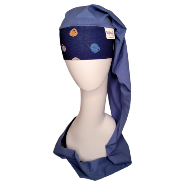 navy blue nillynoggin eeg cap with colorful scribbled dots on the headband